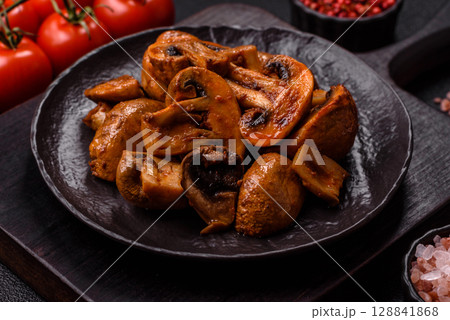 Food, baked mushrooms champignon slices with sauce and spices Food, baked mushrooms champignon slices with sauce and spices 128841868