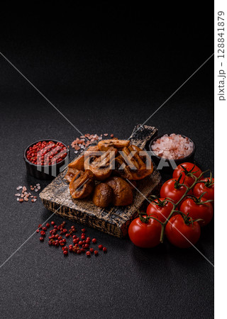 Food, baked mushrooms champignon slices with sauce and spices 128841879