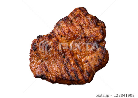 Meat, steak, beef tenderloin cooked on grill. Juicy steak as a food background 128841908