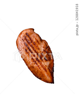 Chicken breast, grilled fillet, meat meal on a plate. Grilled poultry for dinner Chicken breast, grilled fillet, meat meal on a plate. Grilled poultry for dinner 128841918