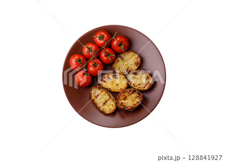 Food, potatoes cut in halves or slices grilled. Cooked baked potatoes Food, potatoes cut in halves or slices grilled. Cooked baked potatoes 128841927