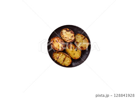Food, potatoes cut in halves or slices grilled. Cooked baked potatoes Food, potatoes cut in halves or slices grilled. Cooked baked potatoes 128841928