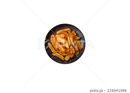 Fried crispy French fries with salt, spices, food for lunch Fried crispy French fries with salt, spices, food for lunch 128841946