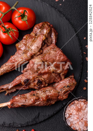 Juicy meat on the bone or rack of lamb. Grilled veal with salt, spices and herbs Juicy meat on the bone or rack of lamb. Grilled veal with salt, spices and herbs 128842024