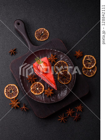 A piece of red velvet cake as a food background. Sweet pastries for celebration A piece of red velvet cake as a food background. Sweet pastries for celebration 128842111