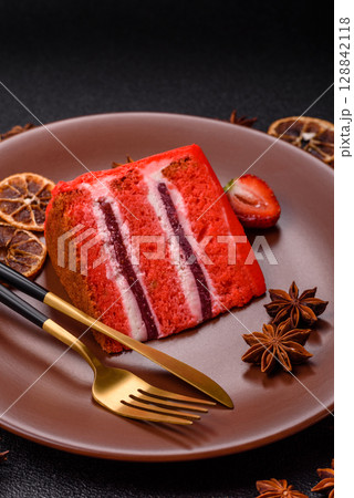 A piece of red velvet cake as a food background. Sweet pastries for celebration A piece of red velvet cake as a food background. Sweet pastries for celebration 128842118