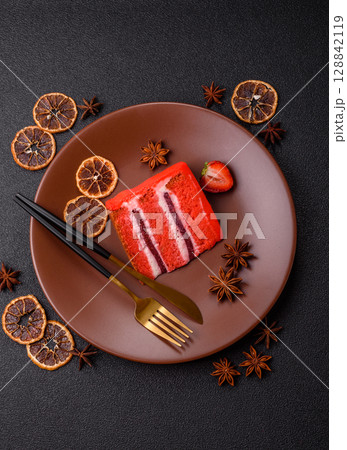 A piece of red velvet cake as a food background. Sweet pastries for celebration A piece of red velvet cake as a food background. Sweet pastries for celebration 128842119