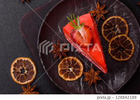 A piece of red velvet cake as a food background. Sweet pastries for celebration 128842189