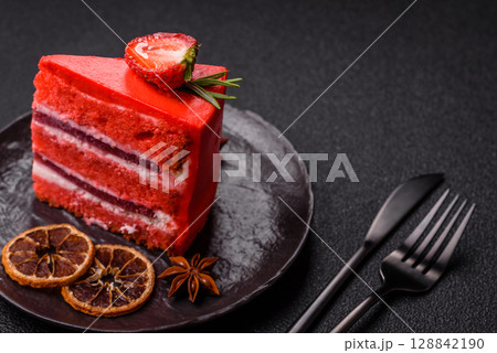 A piece of red velvet cake as a food background. Sweet pastries for celebration 128842190