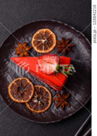 A piece of red velvet cake as a food background. Sweet pastries for celebration A piece of red velvet cake as a food background. Sweet pastries for celebration 128842216