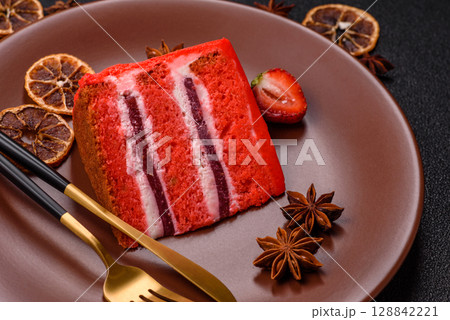 A piece of red velvet cake as a food background. Sweet pastries for celebration A piece of red velvet cake as a food background. Sweet pastries for celebration 128842221