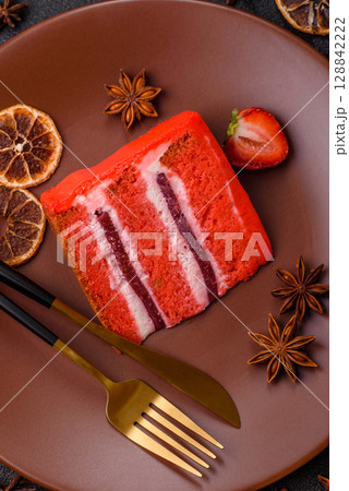 A piece of red velvet cake as a food background. Sweet pastries for celebration A piece of red velvet cake as a food background. Sweet pastries for celebration 128842222