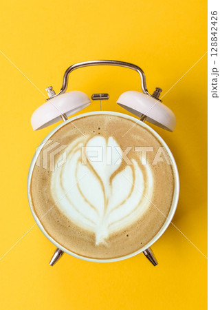 It's coffee time, the signal to drink your morning cappuccino or latte. Concept with a cup of coffee 128842426