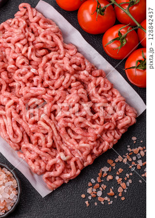 Raw ground beef or pork as an ingredient for burgers. Raw minced meat Raw ground beef or pork as an ingredient for burgers. Raw minced meat 128842437