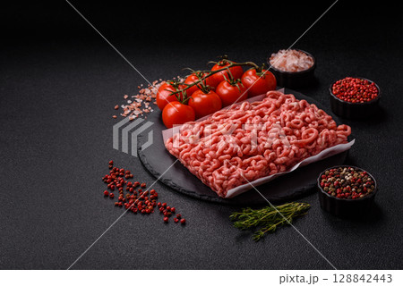 Raw ground beef or pork as an ingredient for burgers. Raw minced meat Raw ground beef or pork as an ingredient for burgers. Raw minced meat 128842443