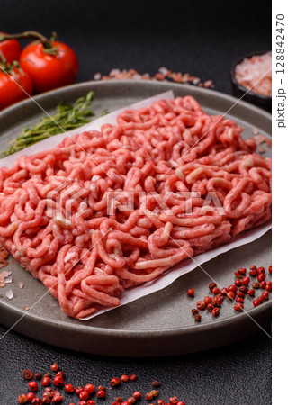 Raw ground beef or pork as an ingredient for burgers. Raw minced meat 128842470