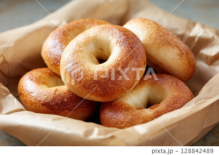 Golden Brown Bagels in Clean Presentation. 128842489