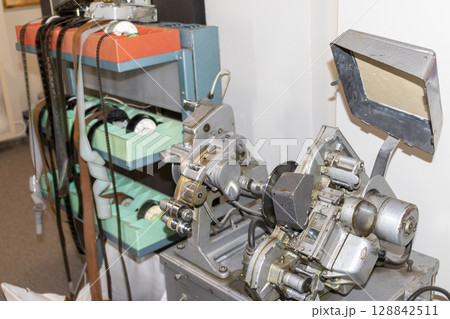 Shot of the vintage, old, obsolete movie film projector. Retro 128842511
