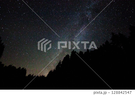 A view of the stars of the Milky Way with a mountain top in the foreground.Perseid Meteor Shower observation 128842547