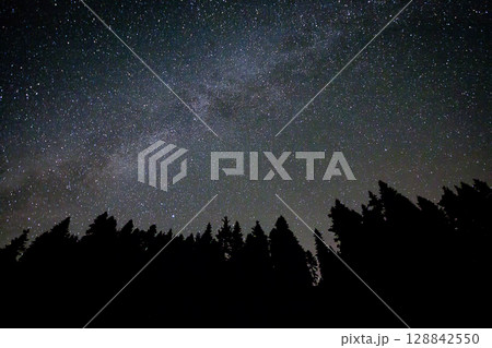 A view of the stars of the Milky Way with a mountain top in the foreground.Perseid Meteor Shower observation A view of the stars of the Milky Way with a mountain top in the foreground.Perseid Meteor Shower observation 128842550