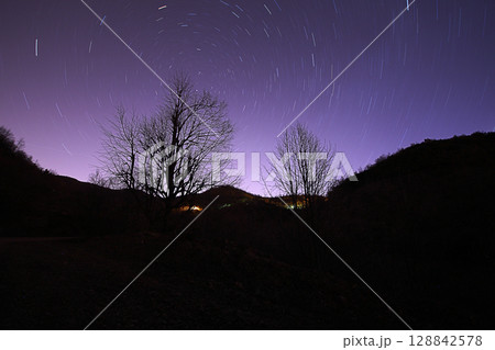 A view of the stars of the Milky Way with a mountain top in the foreground.Perseid Meteor Shower observation A view of the stars of the Milky Way with a mountain top in the foreground.Perseid Meteor Shower observation 128842578