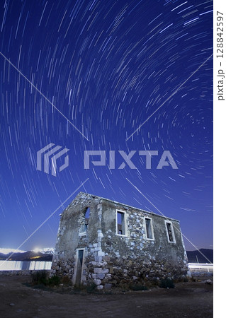 A view of the stars of the Milky Way with a mountain top in the foreground.Perseid Meteor Shower observation 128842597