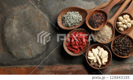 Discover essence of natural healing with this stunning flat lay featuring variety of herbs, spices, dried ingredients. Perfect for themes of wellness, cooking, alternative medicine, organic products Discover essence of natural healing with this stunning flat lay featuring variety of herbs, spices, dried ingredients. Perfect for themes of wellness, cooking, alternative medicine, organic products 128843185