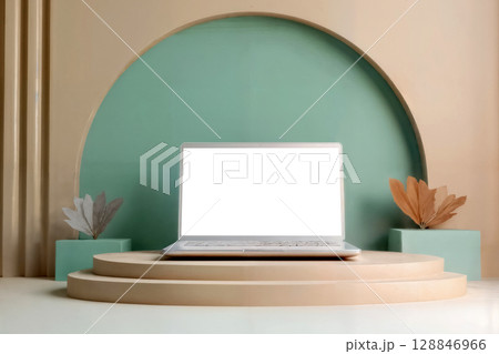 laptop with blank screen on beige podium and turquoise wall 128846966