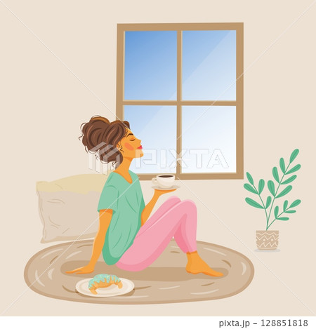 Woman relaxing with coffee by the window 128851818