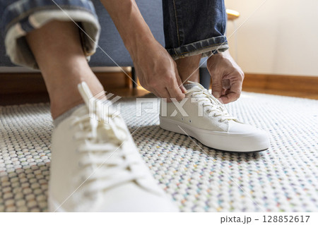 Young man dress shoes at home 128852617