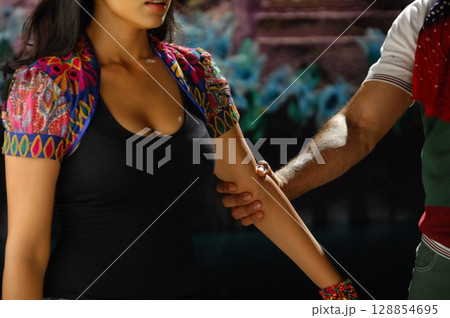 Elegant Indian Woman in Traditional Attire with Sensual Grace Elegant Indian Woman in Traditional Attire with Sensual Grace 128854695