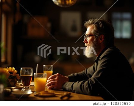 man with beer at bar counter in bar 128855650