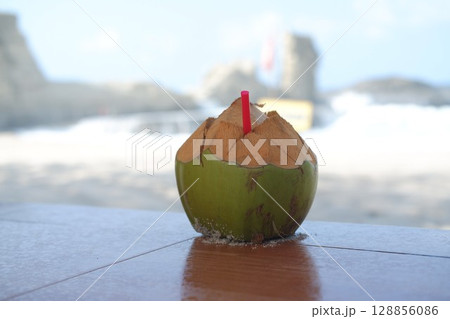 Relaxing Beach Vibes with Fresh Coconut Relaxing Beach Vibes with Fresh Coconut 128856086