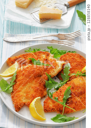 crispy parmesan crusted chicken cutlets, top view 128858140
