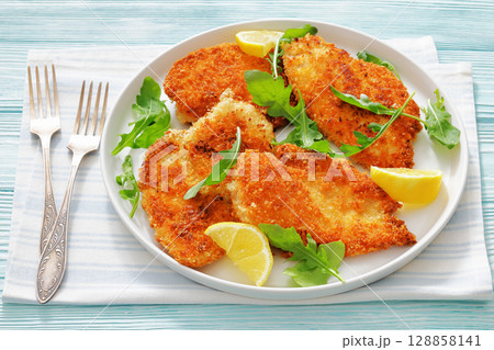 crispy parmesan crusted chicken cutlets, top view 128858141