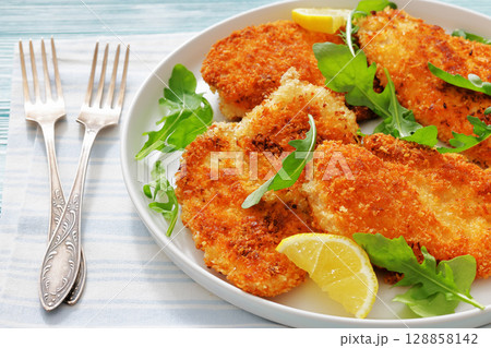 crispy parmesan crusted chicken cutlets, top view 128858142