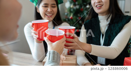 Festive Business Christmas Party Celebration with Colleagues Enjoying Holiday Cheer and Red Cups Festive Business Christmas Party Celebration with Colleagues Enjoying Holiday Cheer and Red Cups 128860006