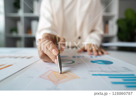Professional Business Analysis with Graphs and Charts in a Modern Office Setting for strategy Planning and Decision Making Professional Business Analysis with Graphs and Charts in a Modern Office Setting for strategy Planning and Decision Making 128860787