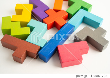 Logical thinking and problem solving creative business solution concept, wooden puzzle geometric shape block shape. Logical thinking and problem solving creative business solution concept, wooden puzzle geometric shape block shape. 128861798