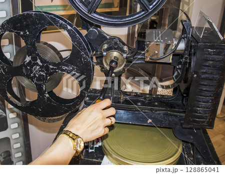 Shot of the vintage, old, obsolete movie film projector Shot of the vintage, old, obsolete movie film projector 128865041