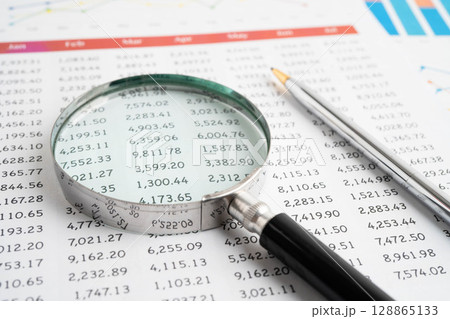 Magnifying glass on charts graphs paper. Financial development, Banking Account, Statistic, Investment Analytic research data economy. Magnifying glass on charts graphs paper. Financial development, Banking Account, Statistic, Investment Analytic research data economy. 128865133