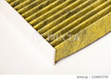 Modern car filter for cleaning the air in the car from bacteria and mold, close-up 128865750