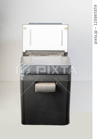 Black car refrigerator on a white background, mobile refrigerator, close-up 128865859