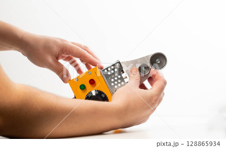 Replacing nozzles on a plumbing electric soldering iron on a white background, isolate, close-up 128865934