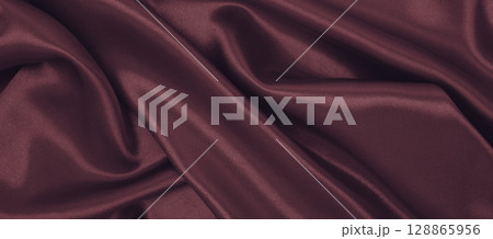 Smooth elegant pink silk or satin luxury cloth texture as abstract background. Luxurious valentines day background design Smooth elegant pink silk or satin luxury cloth texture as abstract background. Luxurious valentines day background design 128865956