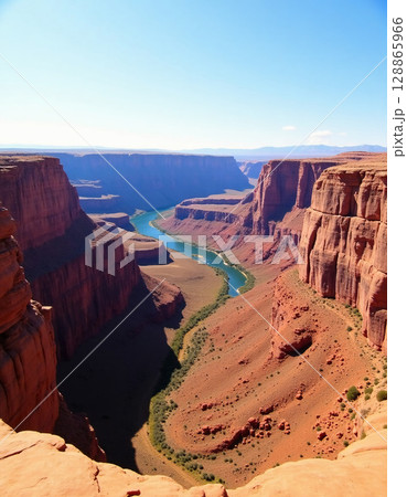 Majestic red rock cliffs frame a winding river, creating a perfect curve against a bright blue sky. The serene landscape offers a glimpse of nature's beauty in a tranquil setting Generative AI 128865966