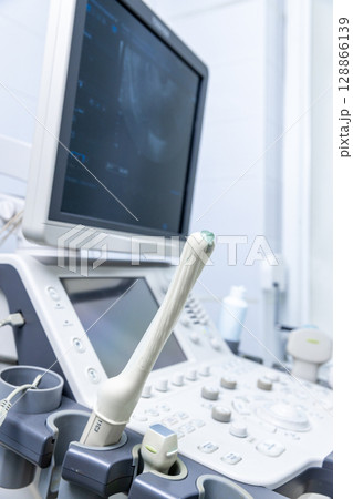 Advanced Medical Imaging Equipment in a Clinical Setting with an Ultrasound Machine Displaying Diagnostic Images on a Screen for Patient Assessments and Examinations Advanced Medical Imaging Equipment in a Clinical Setting with an Ultrasound Machine Displaying Diagnostic Images on a Screen for Patient Assessments and Examinations 128866139