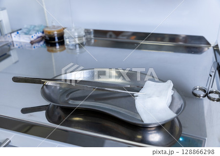 Medical Instruments on a Surgical Tray: A Detailed Look at Essential Tools Used in Surgical Procedures Within a Clinical Setting 128866298
