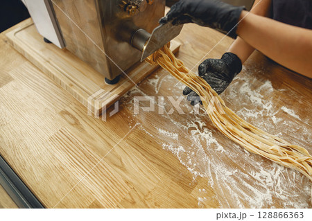 The process of creating homemade pasta in the kitchen is both enjoyable and rewarding The process of creating homemade pasta in the kitchen is both enjoyable and rewarding 128866363