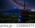 Chureito Pagoda under a star-filled night sky with the majestic silhouette of Mount Fuji in the background, Arakurayama Sengen Park, Japan 128866979